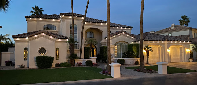 Beautiful home exterior lit up with trimlight. Trimlight vs. Traditional Lighting concept image